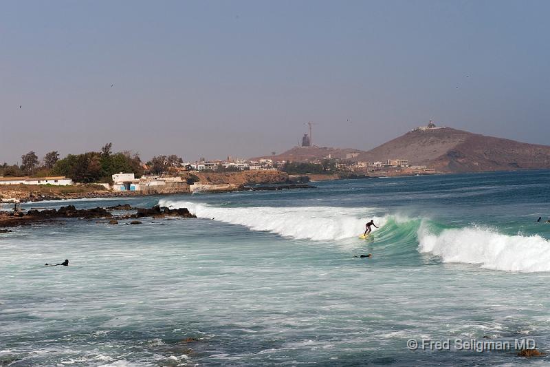 20090529_154446 D3 P1 P1 S1.jpg - Surfing, Atlantic coast, Dakar suburb.  Note the 'monument' on the hill (photo #1). The structure on the hill most to the right is a lighthouse